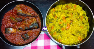 Nigerian fried rice with fried fish in pepper sauce