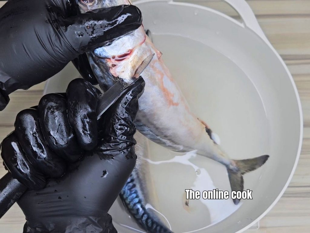 Knife removing the fish fins