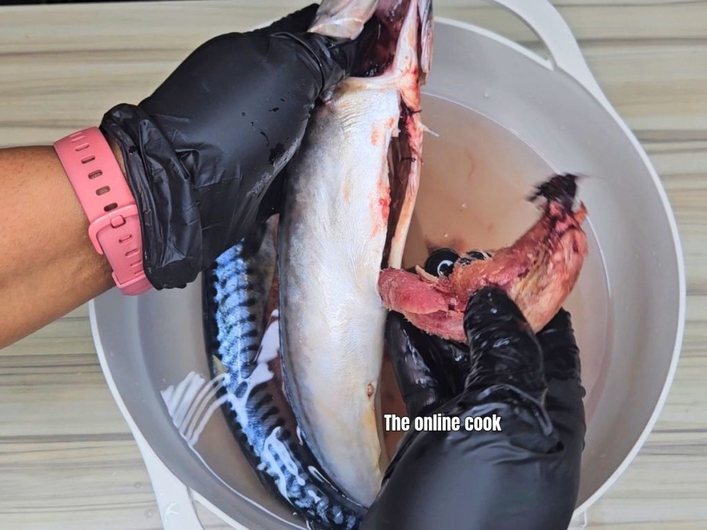 Removing internal organs from fish during cleaning process