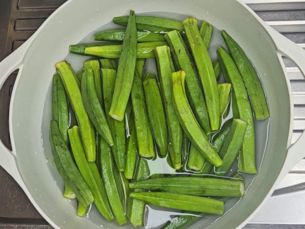 washing-and-slicing-fresh-okra